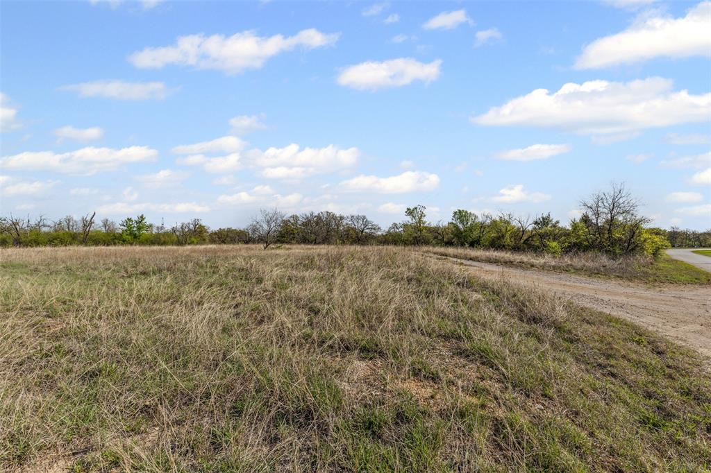 5 County Road 3855 Poolville, TX 76487 - Photo 4 of 16 a view of a lake with houses in the back