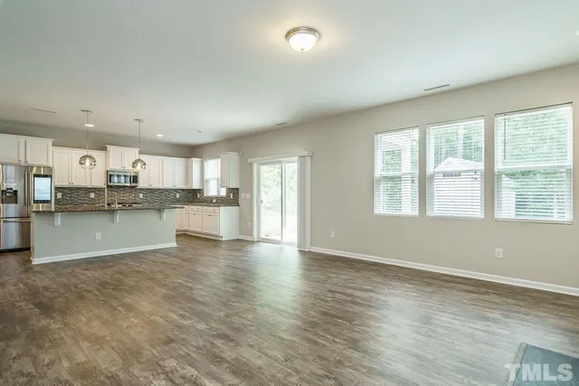 a view of kitchen with wooden floor