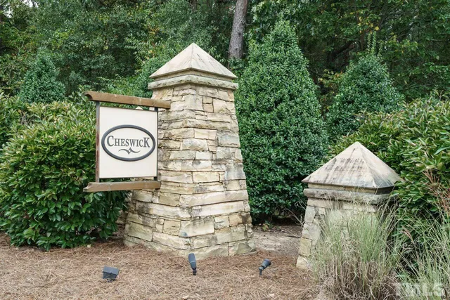 a view of a house with a yard and garage