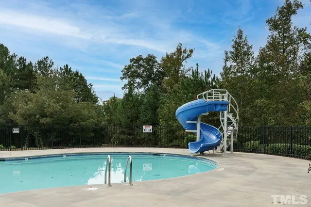 a view of a bench in the backyard