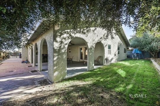 1113 Amie Court Ridgecrest, CA 93555 - Photo 32 of 33 a front view of a house with garden