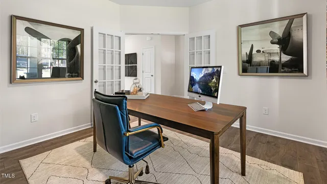 a view of a workspace with furniture