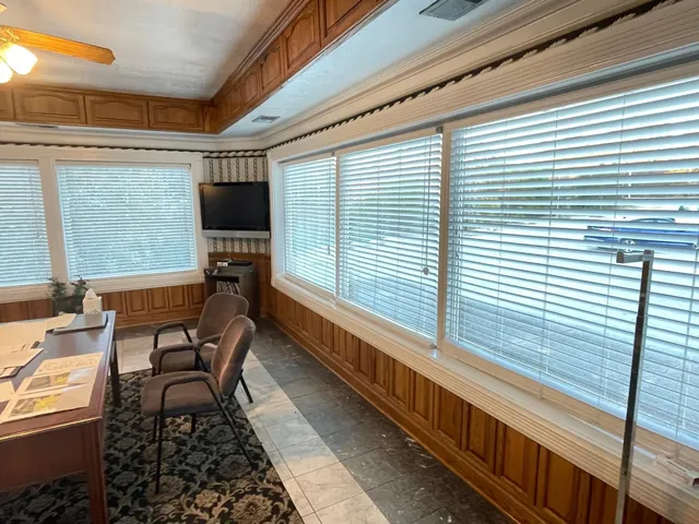 a balcony with furniture and a window