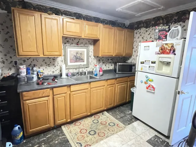 a living room with furniture and floor to ceiling windows