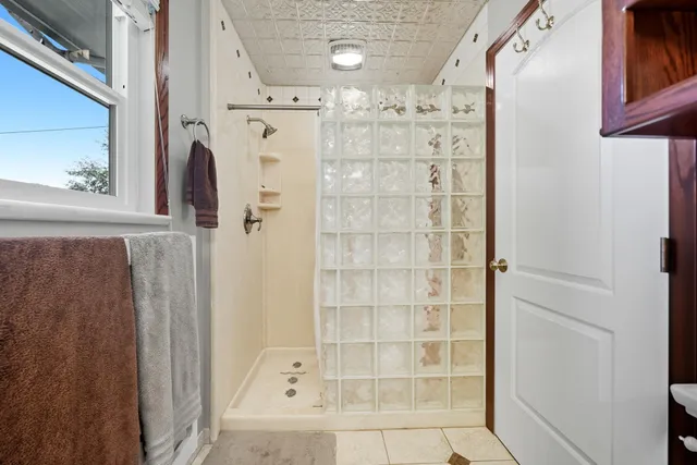 a bathroom with a bathtub and a shower