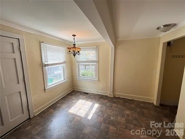 a view of livingroom with window hardwood floor and staircase