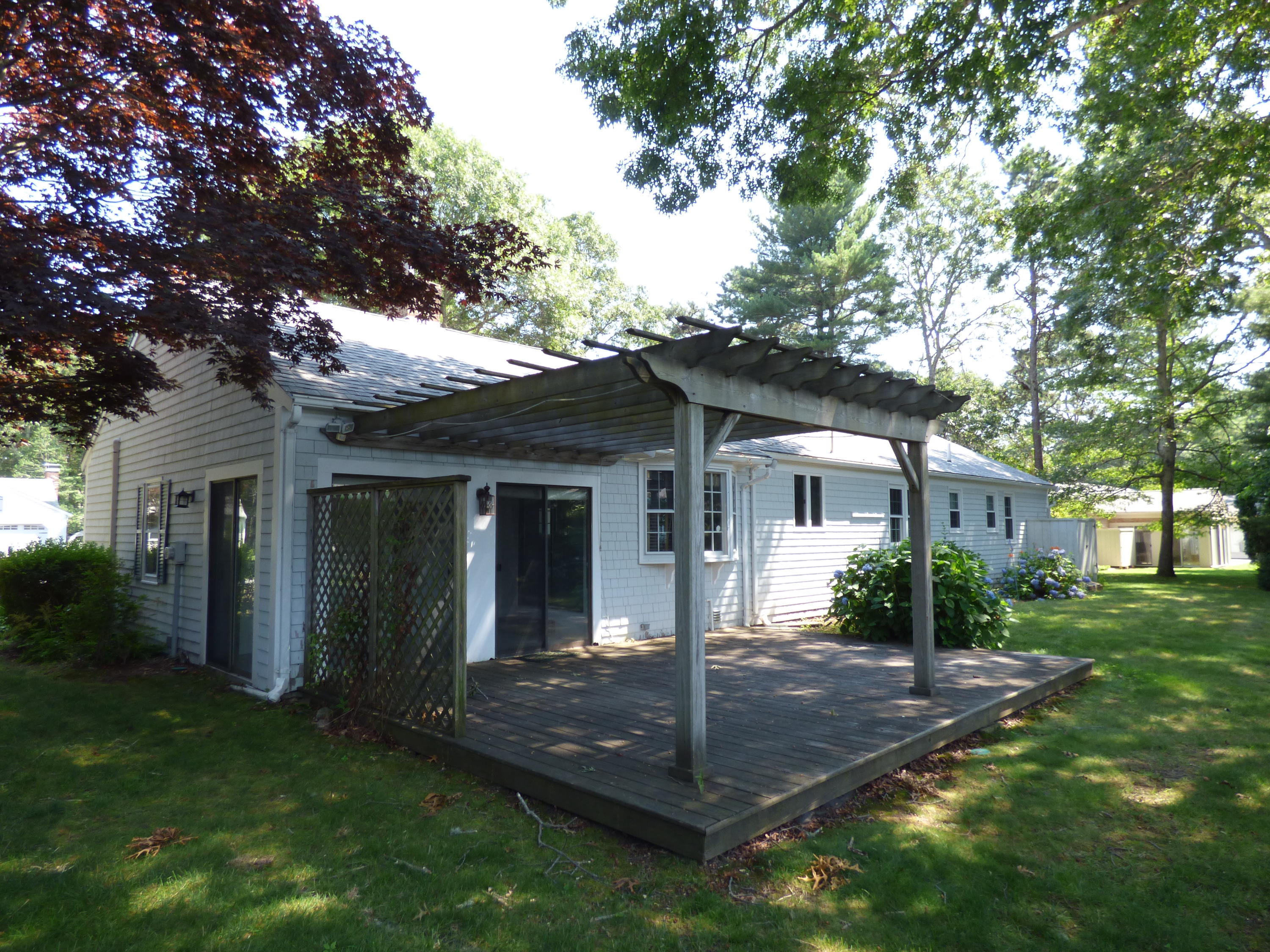 195 Ansel Howland Road Centerville, MA 02632 - Photo 14 of 22 front view of a house with a yard