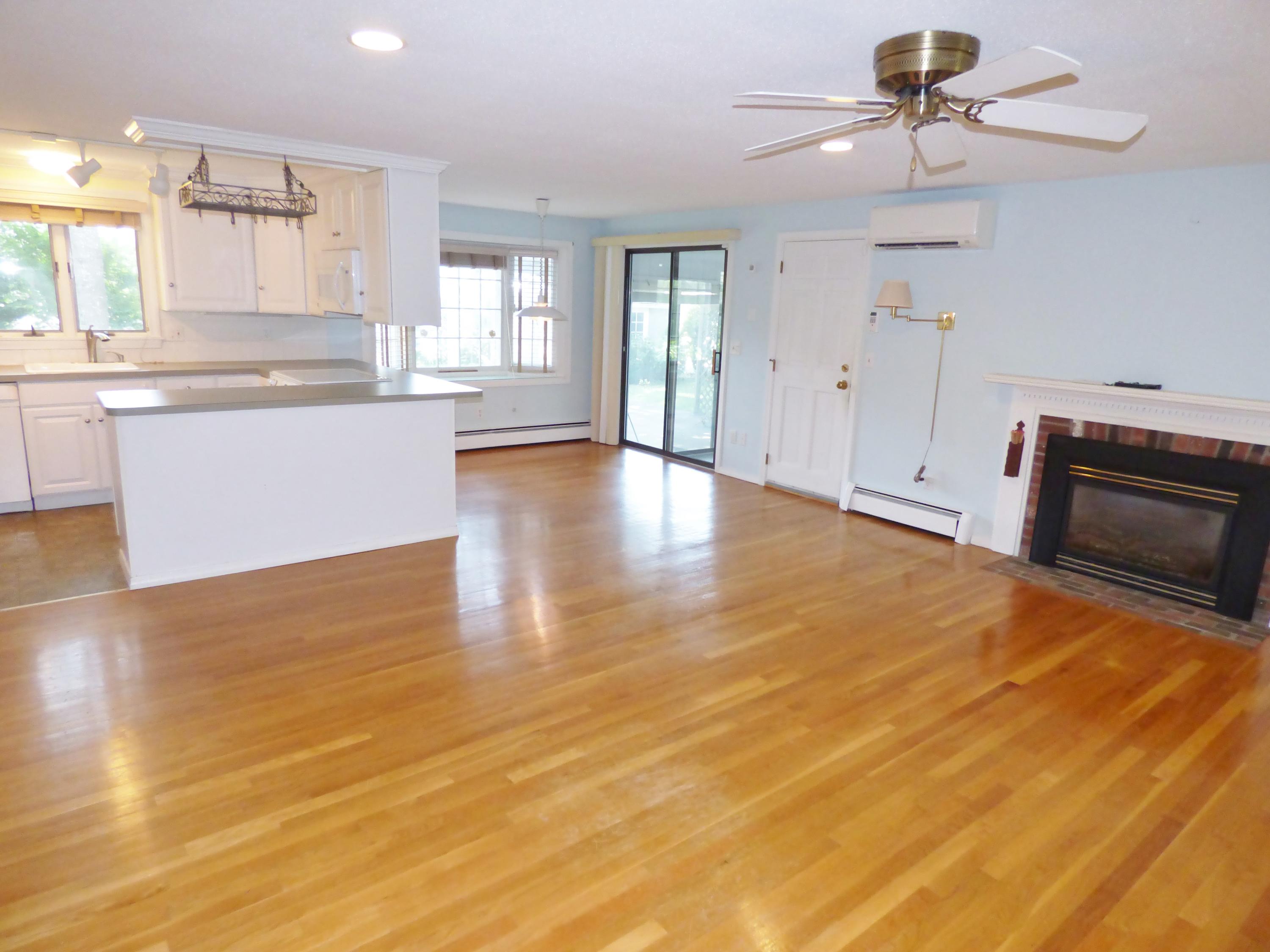 195 Ansel Howland Road Centerville, MA 02632 - Photo 2 of 22 a large kitchen with stainless steel appliances wooden floor and a window