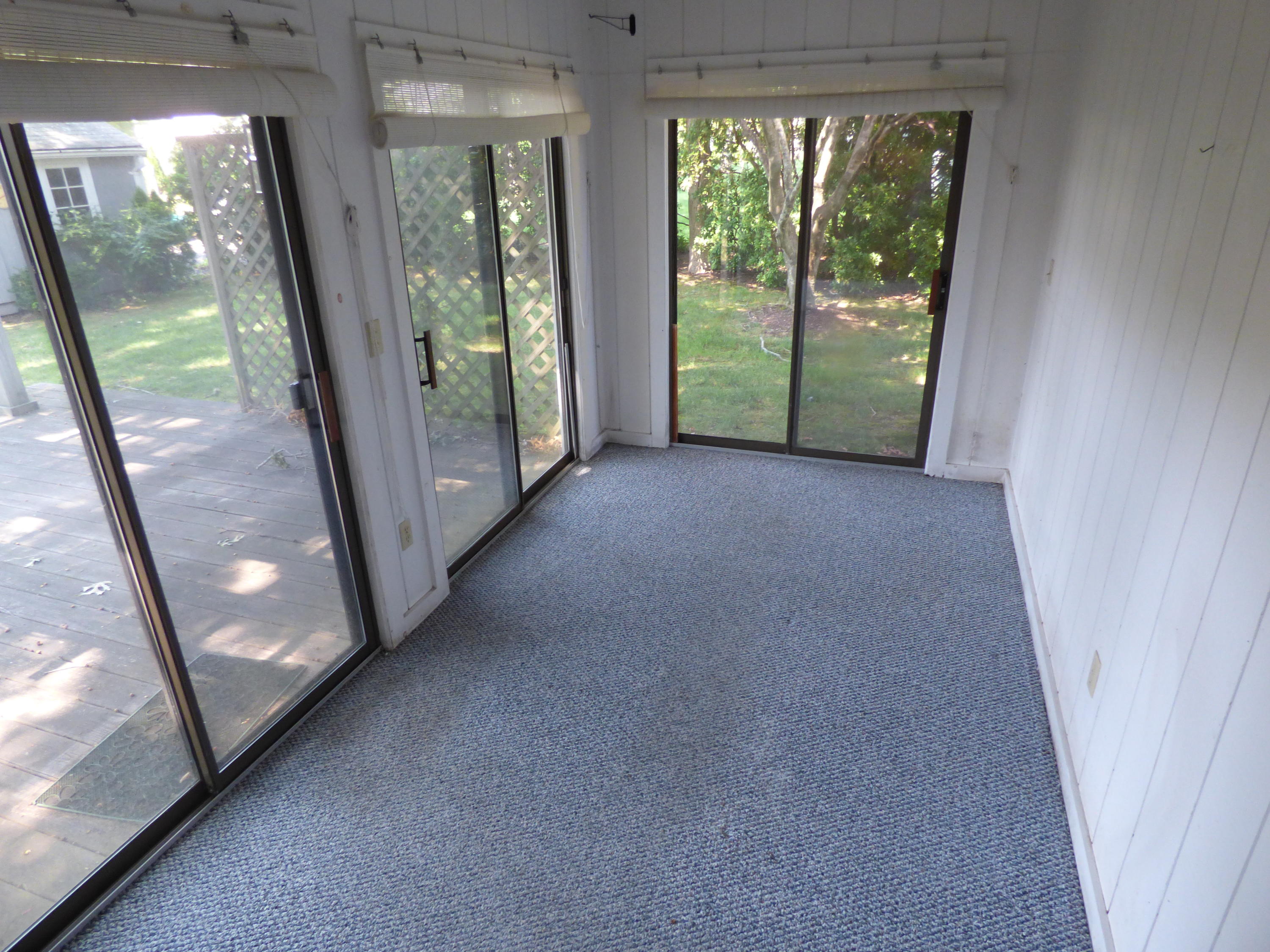 195 Ansel Howland Road Centerville, MA 02632 - Photo 7 of 22 a view of a room with large window