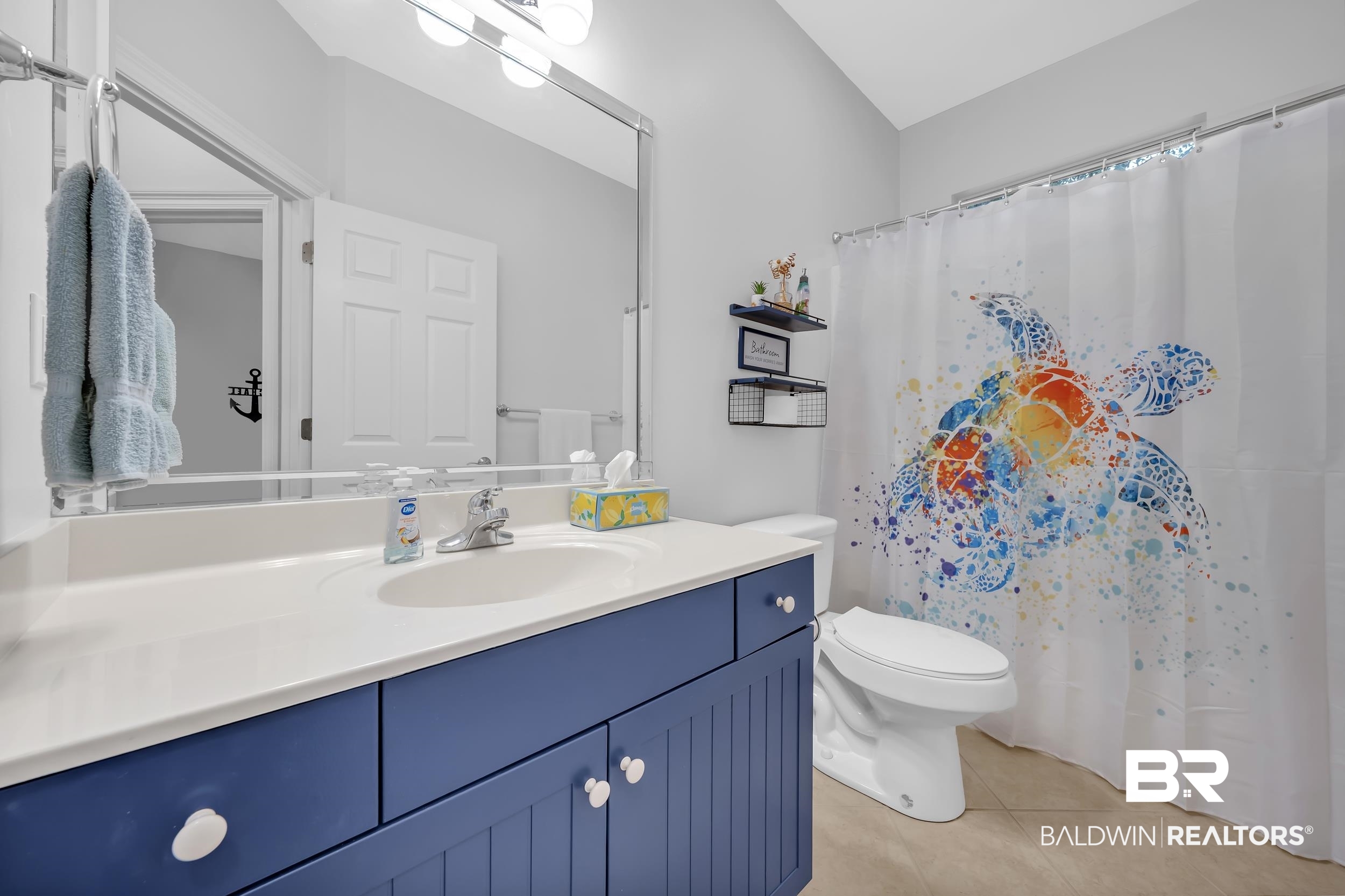 105 Mark Twain Loop Foley, AL 36535 - Photo 18 of 43 Bathroom with a shower with shower curtain, vanity, and light tile patterned floors