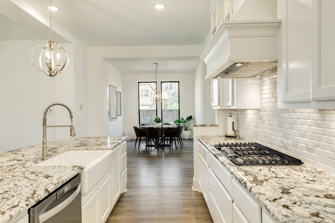 10102 Brush Way Rosharon, TX 77583 - Photo 16 of 50 Beautiful granite countertops, stainless steel appliances, and beautiful backsplash.
