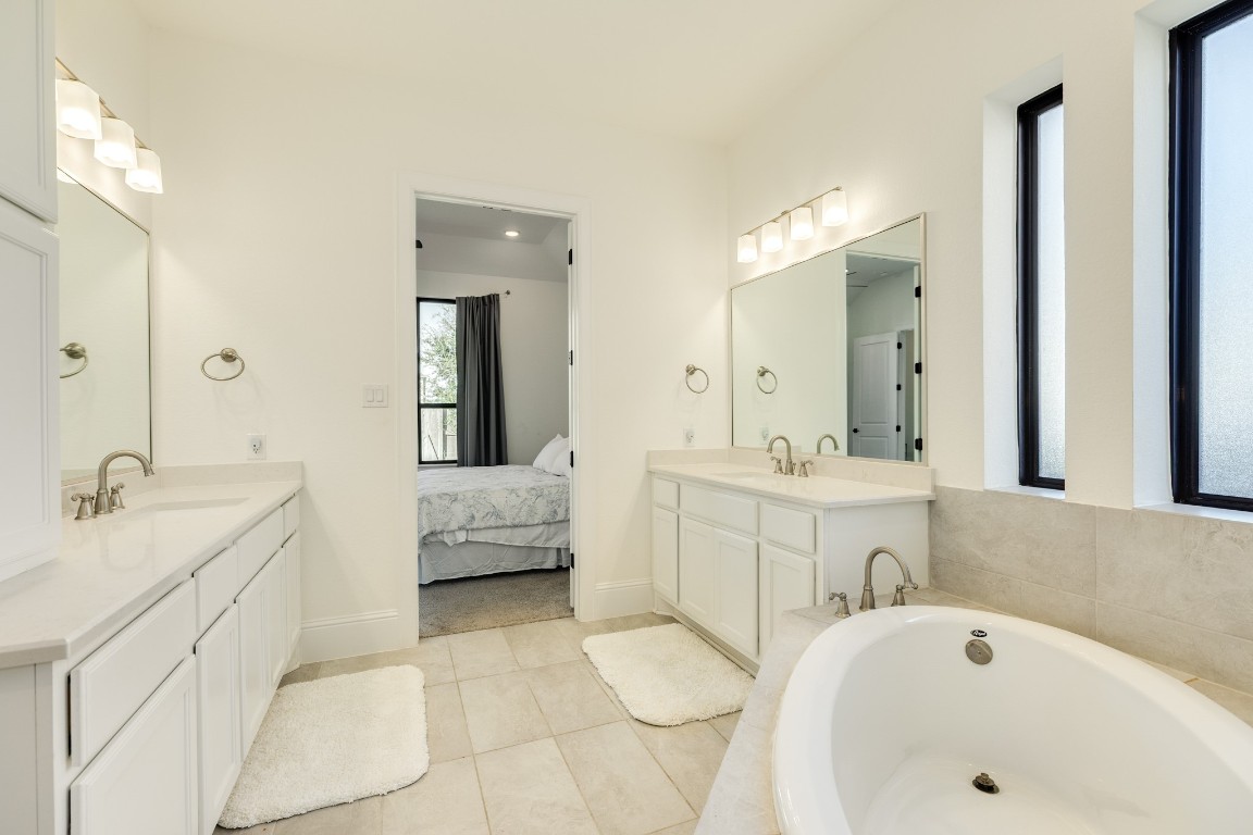 10102 Brush Way Rosharon, TX 77583 - Photo 25 of 50 This view highlights the spaciousness of the primary bath, featuring double vanities.
