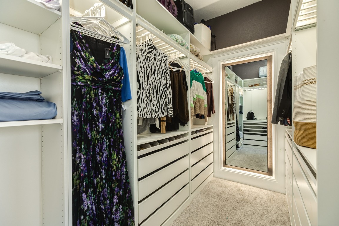 10102 Brush Way Rosharon, TX 77583 - Photo 26 of 50 This primary walk-in closet features ample built-in storage.
