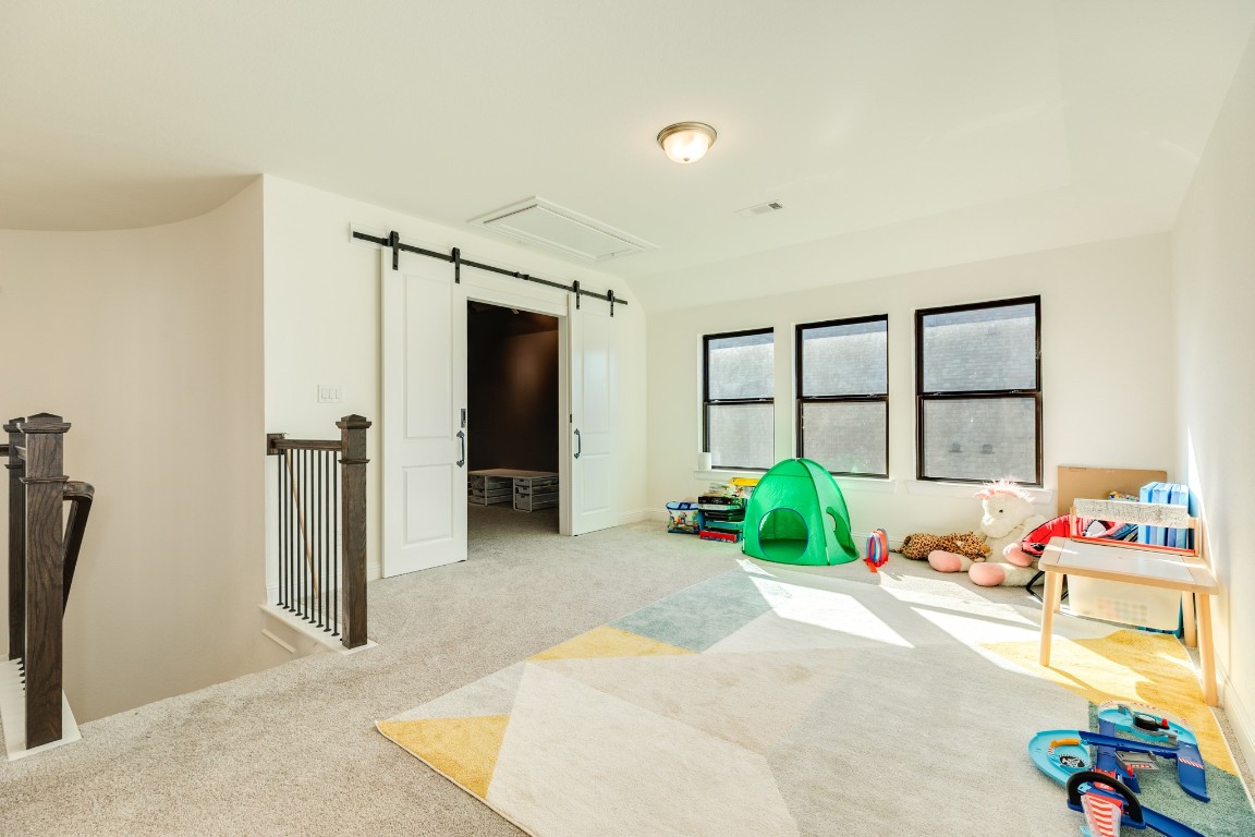 10102 Brush Way Rosharon, TX 77583 - Photo 28 of 50 The play area is very spacious, and the windows allow natural light to flood in, creating a bright and inviting space.