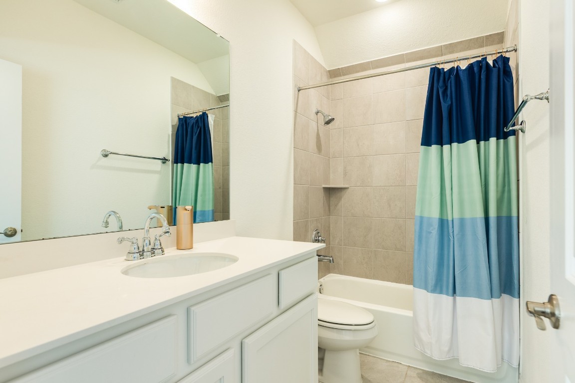 10102 Brush Way Rosharon, TX 77583 - Photo 34 of 50 Bathroom 2 of 2 upstairs features a combo bath/shower tub and a large vanity.
