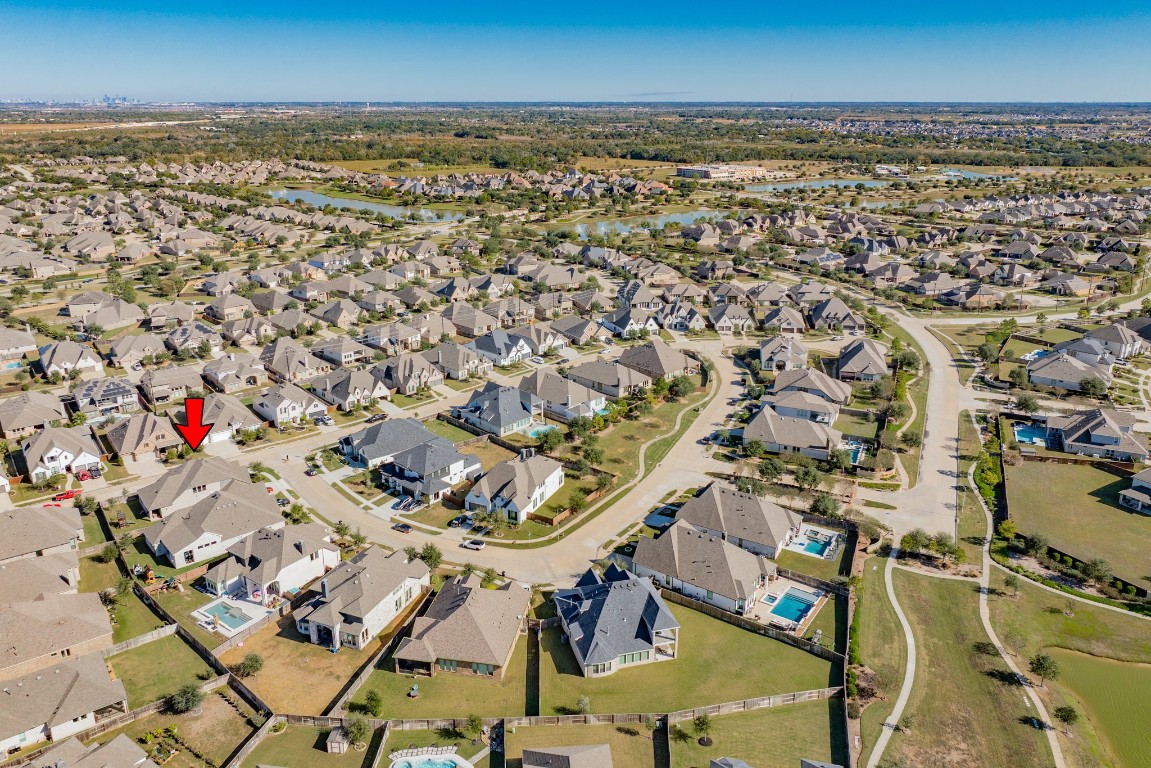 10102 Brush Way Rosharon, TX 77583 - Photo 44 of 50 This depicts an increasingly distant aerial view of Meridiana, featuring two elementary schools, two middle schools, one high school, and Freedom Field Stadium.