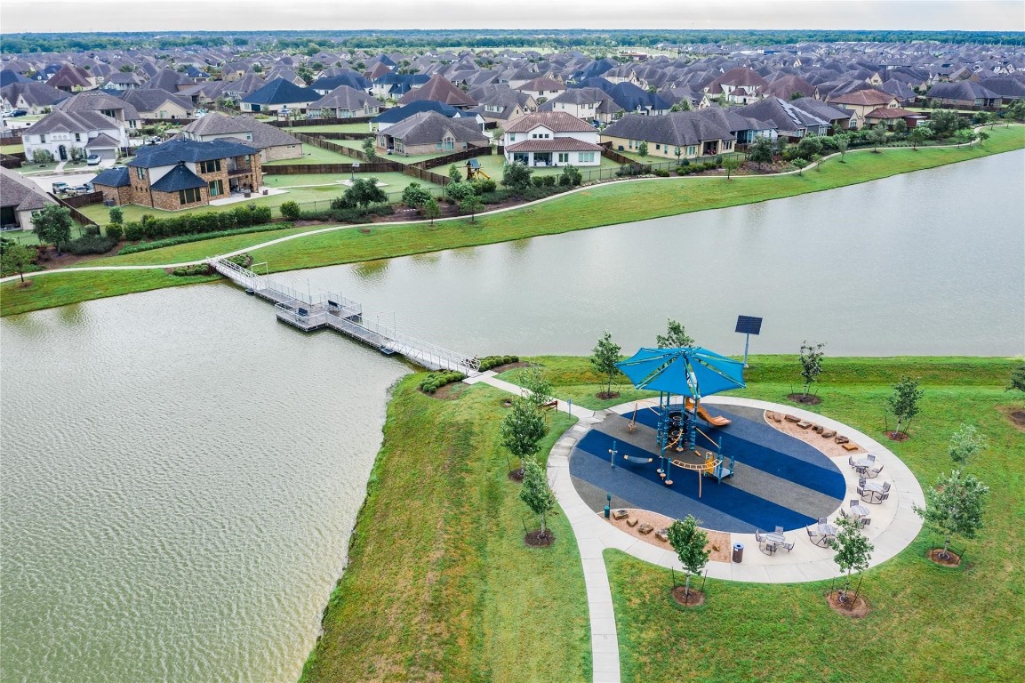 10102 Brush Way Rosharon, TX 77583 - Photo 46 of 50 This is Adventure Lake; non-motorized activities are permitted. The lake features a swinging bridge that connects to the playground. ****BUT NO SWIMMING****
