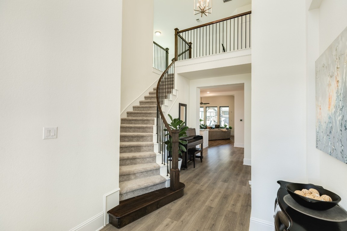 10102 Brush Way Rosharon, TX 77583 - Photo 5 of 50 This beautiful staircase leads to two bedrooms, two bathrooms, a game room, and a media room located upstairs.