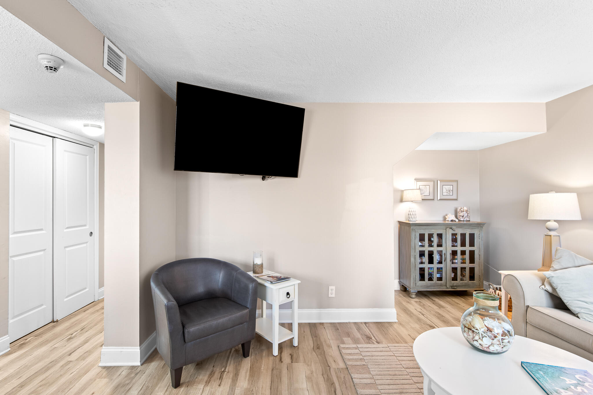 23223 Front Beach Road, Unit 113 Panama City Beach, FL 32413 - Photo 16 of 67 a living room with furniture and a flat screen tv