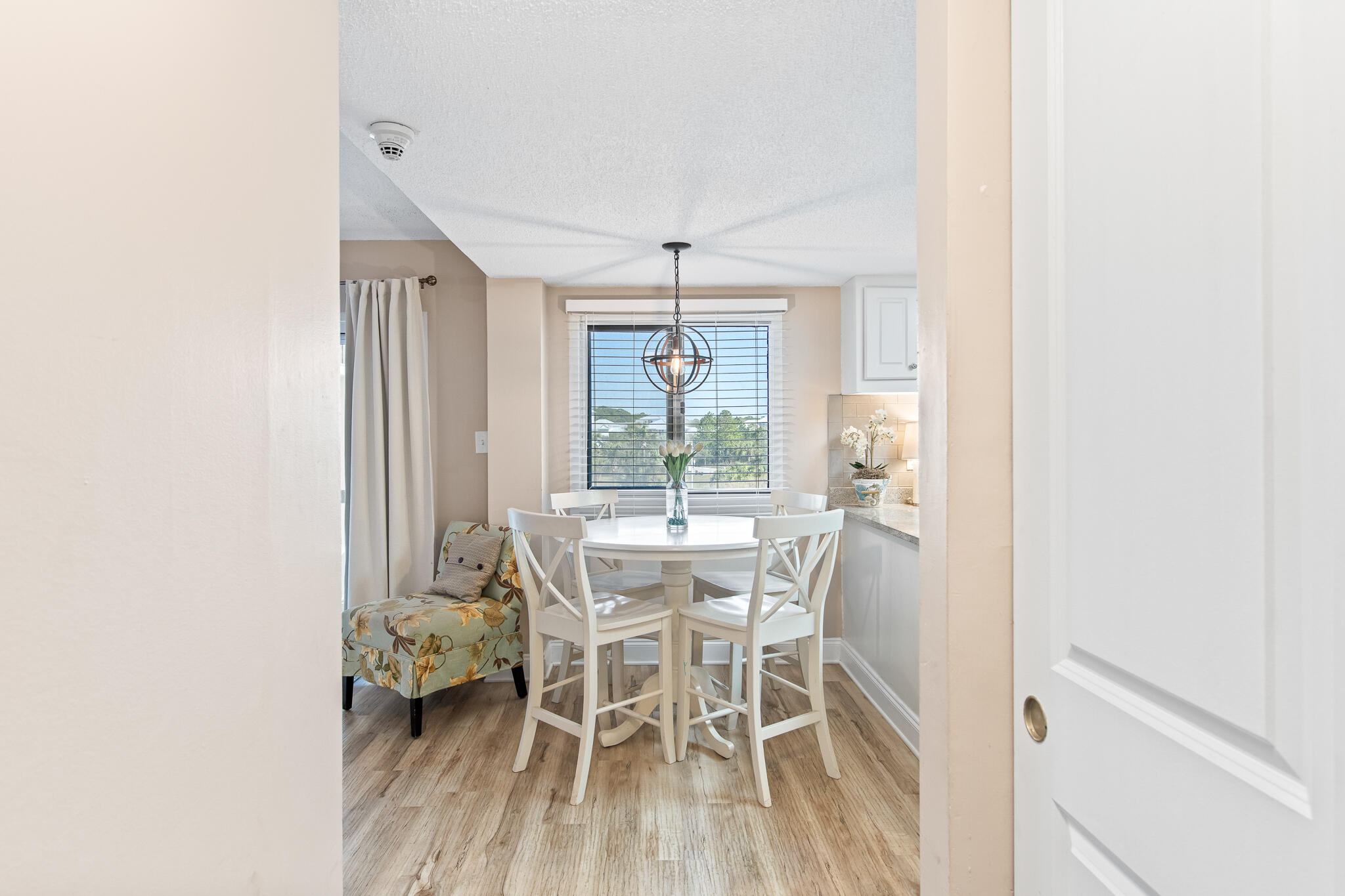 23223 Front Beach Road, Unit 113 Panama City Beach, FL 32413 - Photo 23 of 67 a dining room with furniture and window