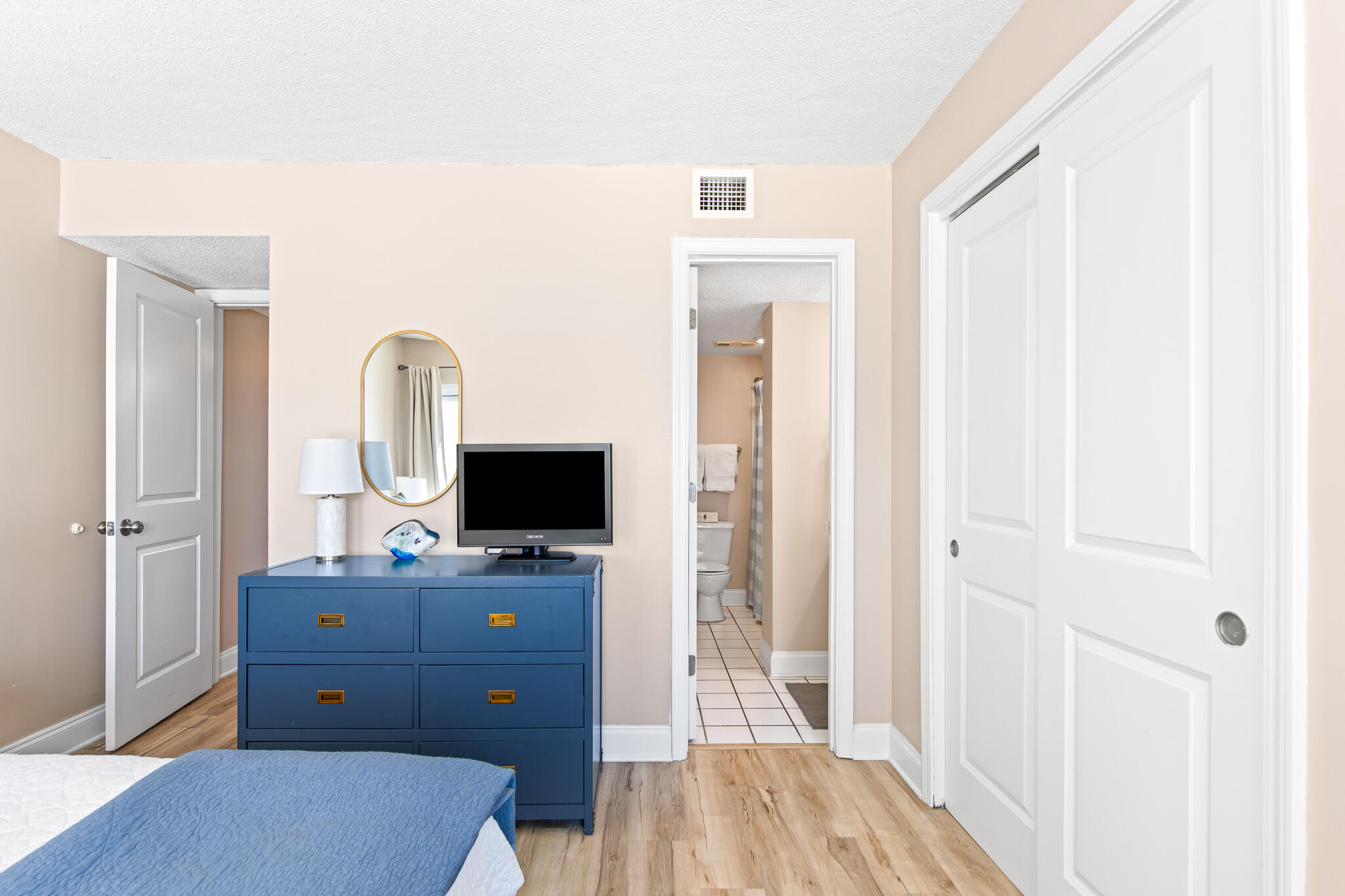 23223 Front Beach Road, Unit 113 Panama City Beach, FL 32413 - Photo 30 of 67 a view of a workspace with furniture and wooden floor
