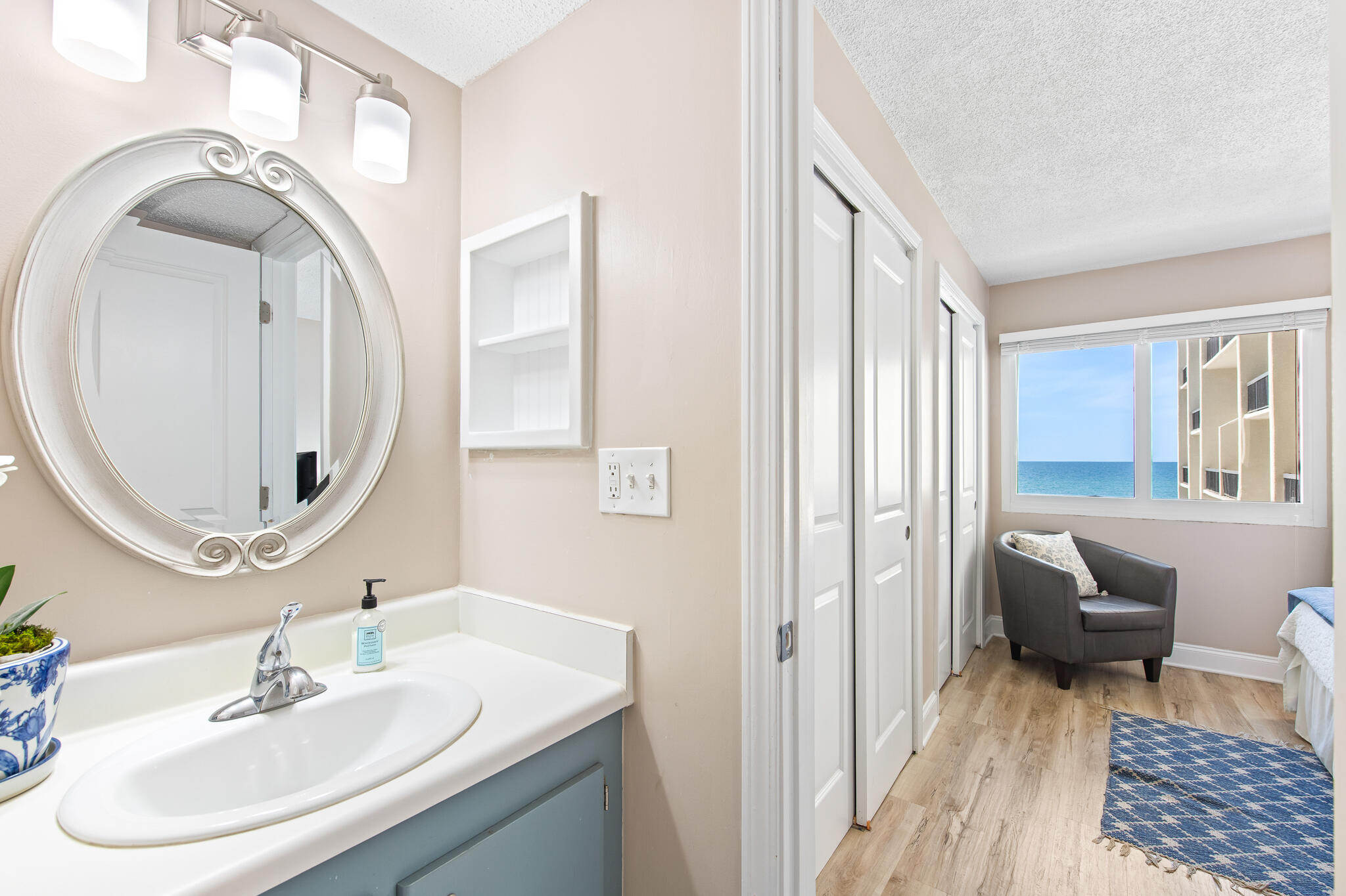 23223 Front Beach Road, Unit 113 Panama City Beach, FL 32413 - Photo 37 of 67 a bathroom with a sink and a mirror
