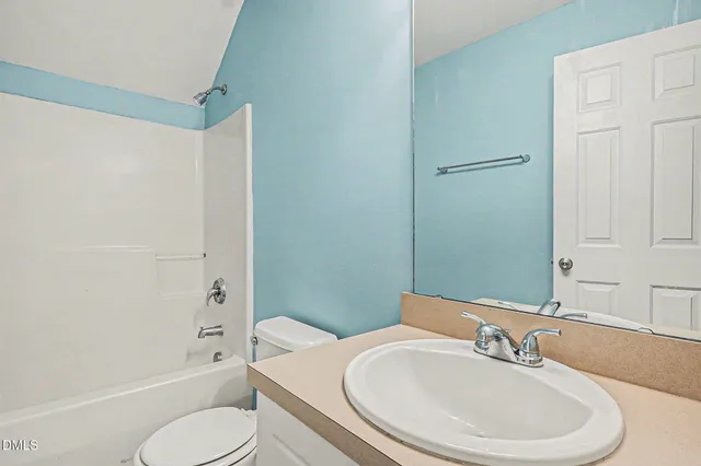 a bathroom with a toilet a sink and a bathtub