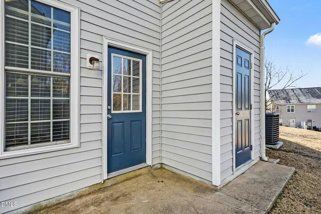 a view of a house with a snow on the road