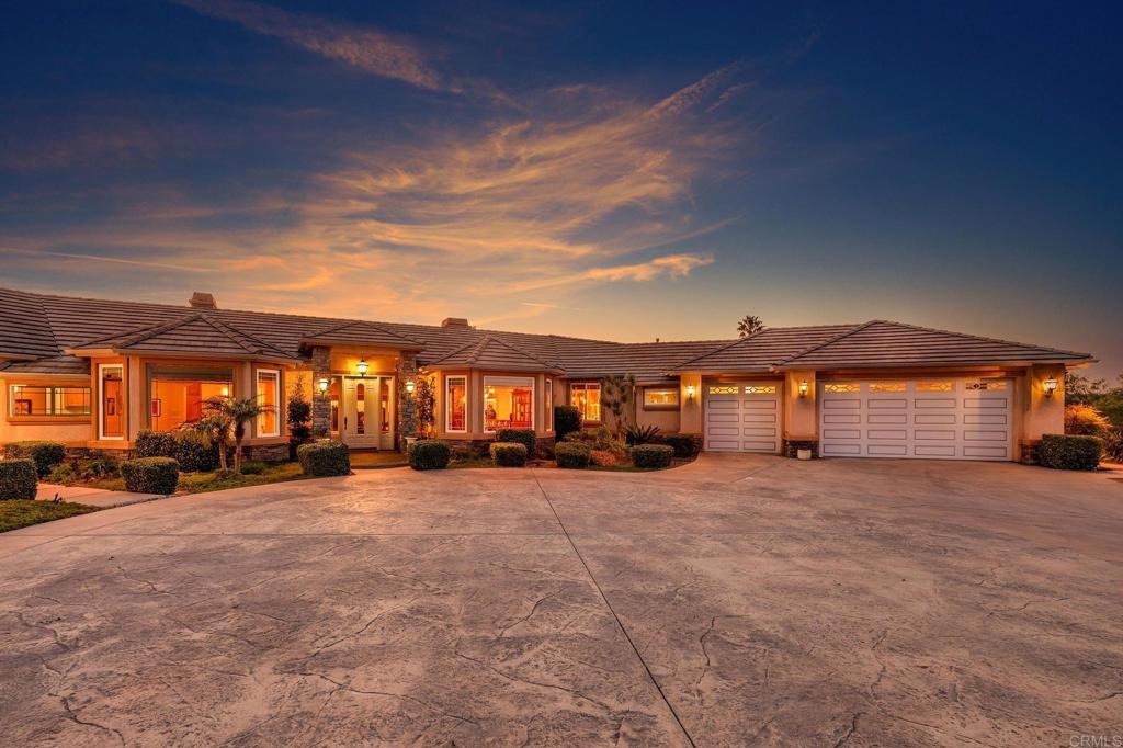 2974 Sumac Road Fallbrook, CA 92028 - Photo 1 of 1 a view of a house with a yard and many windows