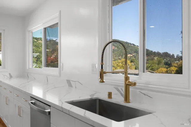 a kitchen with a sink and a window