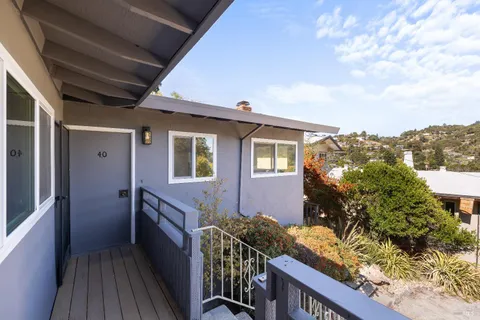 a view of balcony with furniture and wooden floor