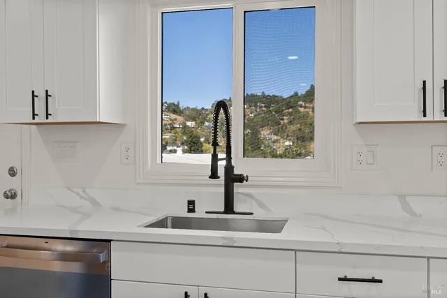a kitchen with a sink and a window
