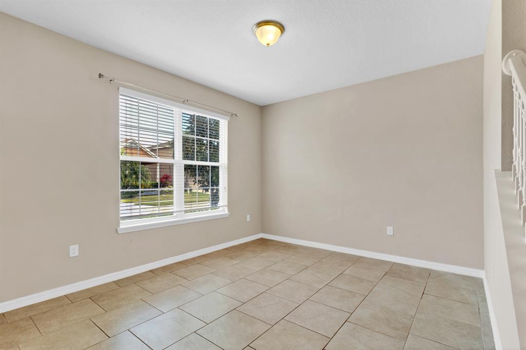 1578 Softshell Street St. Cloud, FL 34771 - Photo 11 of 27 a view of an empty room with a window