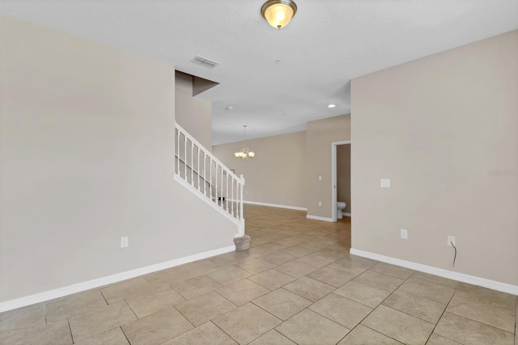 1578 Softshell Street St. Cloud, FL 34771 - Photo 12 of 27 a view of a hallway with staircase