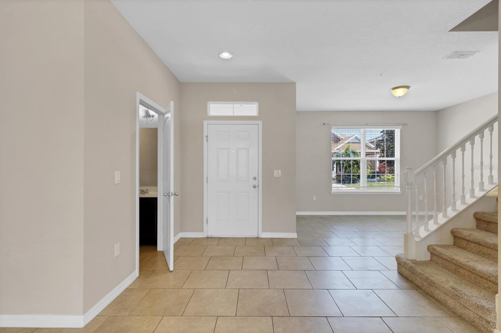 1578 Softshell Street St. Cloud, FL 34771 - Photo 13 of 27 a view of an entryway with stairs