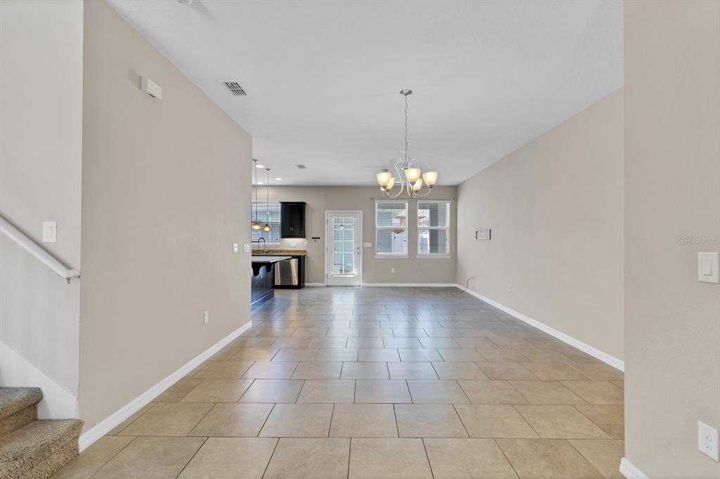 1578 Softshell Street St. Cloud, FL 34771 - Photo 14 of 27 a view of livingroom with kitchen