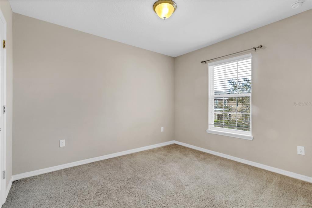 1578 Softshell Street St. Cloud, FL 34771 - Photo 17 of 27 an empty room with a window