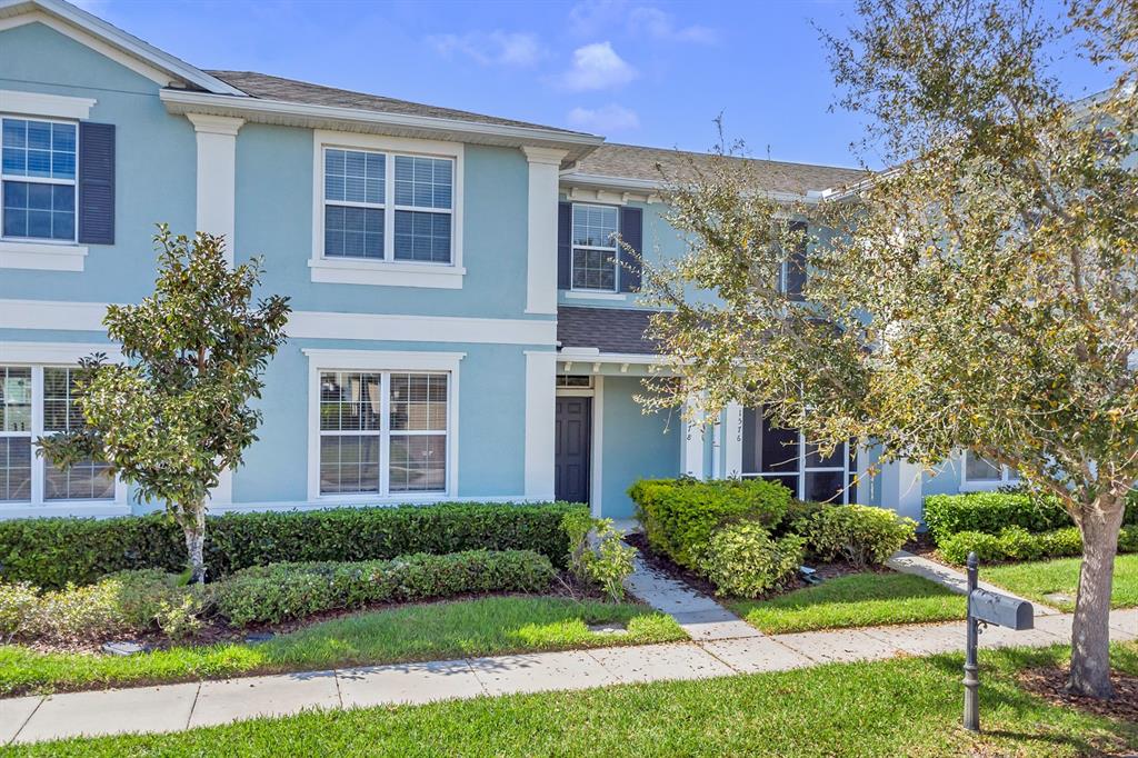 1578 Softshell Street St. Cloud, FL 34771 - Photo 2 of 27 a front view of a house with a yard