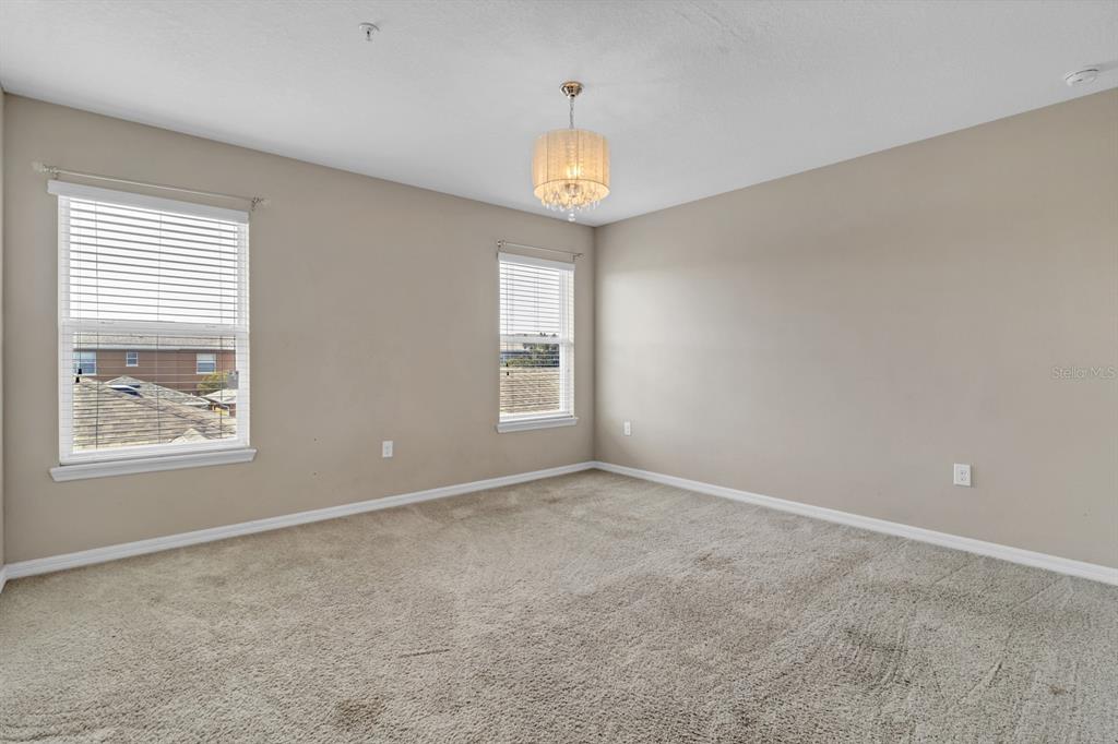 1578 Softshell Street St. Cloud, FL 34771 - Photo 22 of 27 a view of an empty room with a window