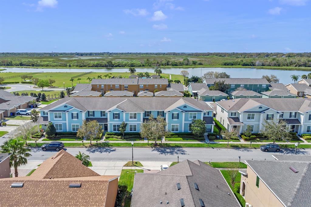1578 Softshell Street St. Cloud, FL 34771 - Photo 23 of 27 an aerial view of multiple houses with a yard