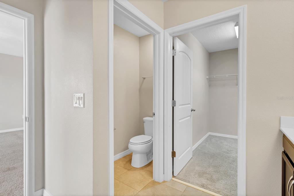 1578 Softshell Street St. Cloud, FL 34771 - Photo 27 of 27 a bathroom with a toilet and a shower