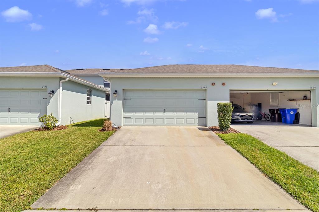 1578 Softshell Street St. Cloud, FL 34771 - Photo 3 of 27 a view of garage and yard