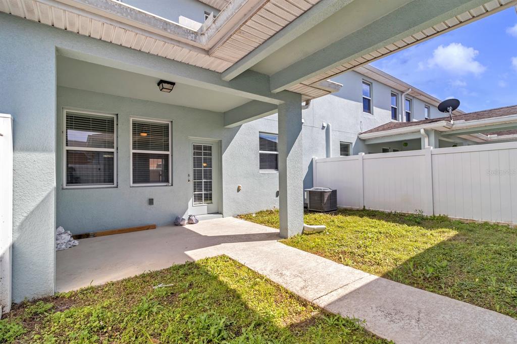 1578 Softshell Street St. Cloud, FL 34771 - Photo 4 of 27 a front view of a house with a yard