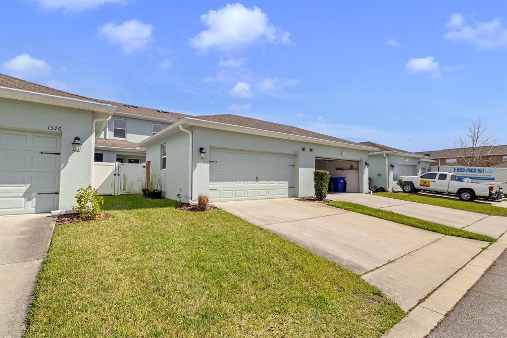1578 Softshell Street St. Cloud, FL 34771 - Photo 8 of 27 a house view with a outdoor space