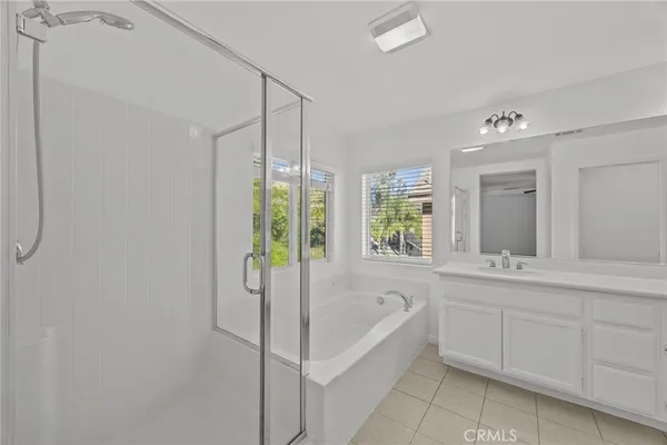 a bathroom with a bathtub and a sink