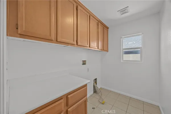 a bathroom with a double vanity sink mirror and toilet