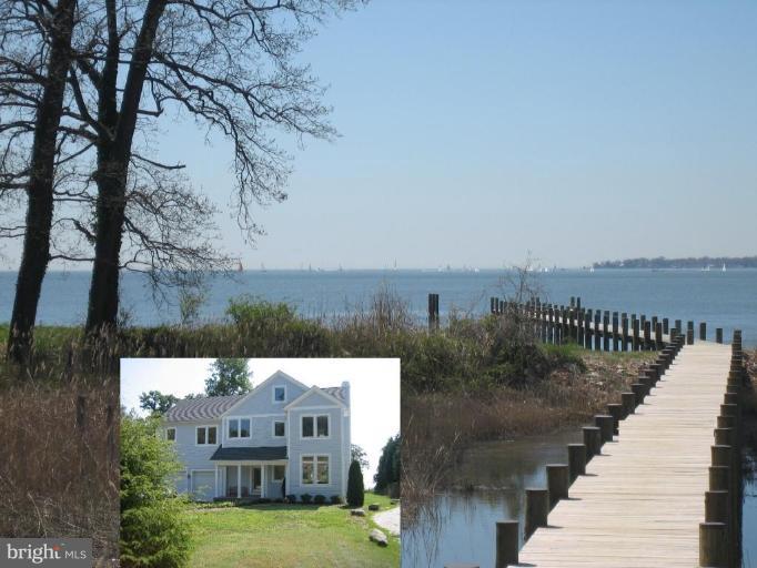 1405 Sharps Point Road Annapolis, MD 21409 - Photo 1 of 14 a view of a lake with a yard and large trees