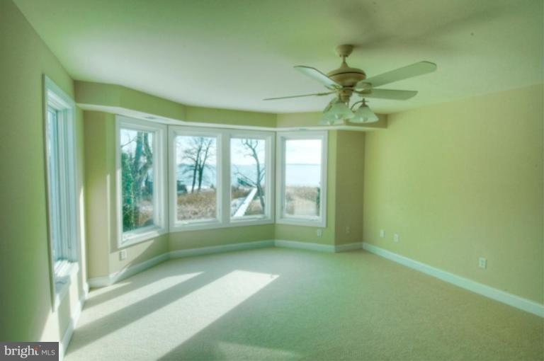 1405 Sharps Point Road Annapolis, MD 21409 - Photo 2 of 14 a view of an empty room with a window