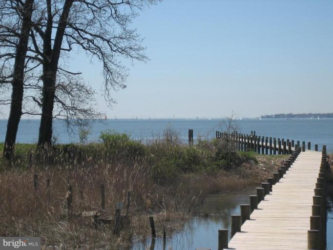 1405 Sharps Point Road Annapolis, MD 21409 - Photo 11 of 14 a view of a lake with a yard