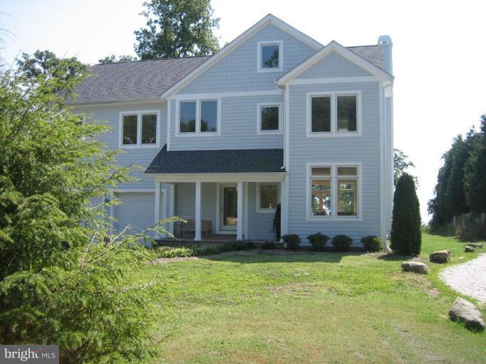 1405 Sharps Point Road Annapolis, MD 21409 - Photo 12 of 14 a front view of a house with a yard